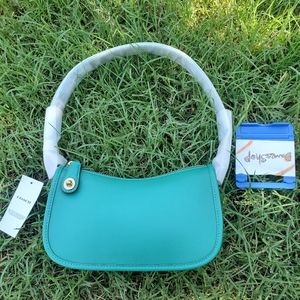 sold Coach swinger NWT